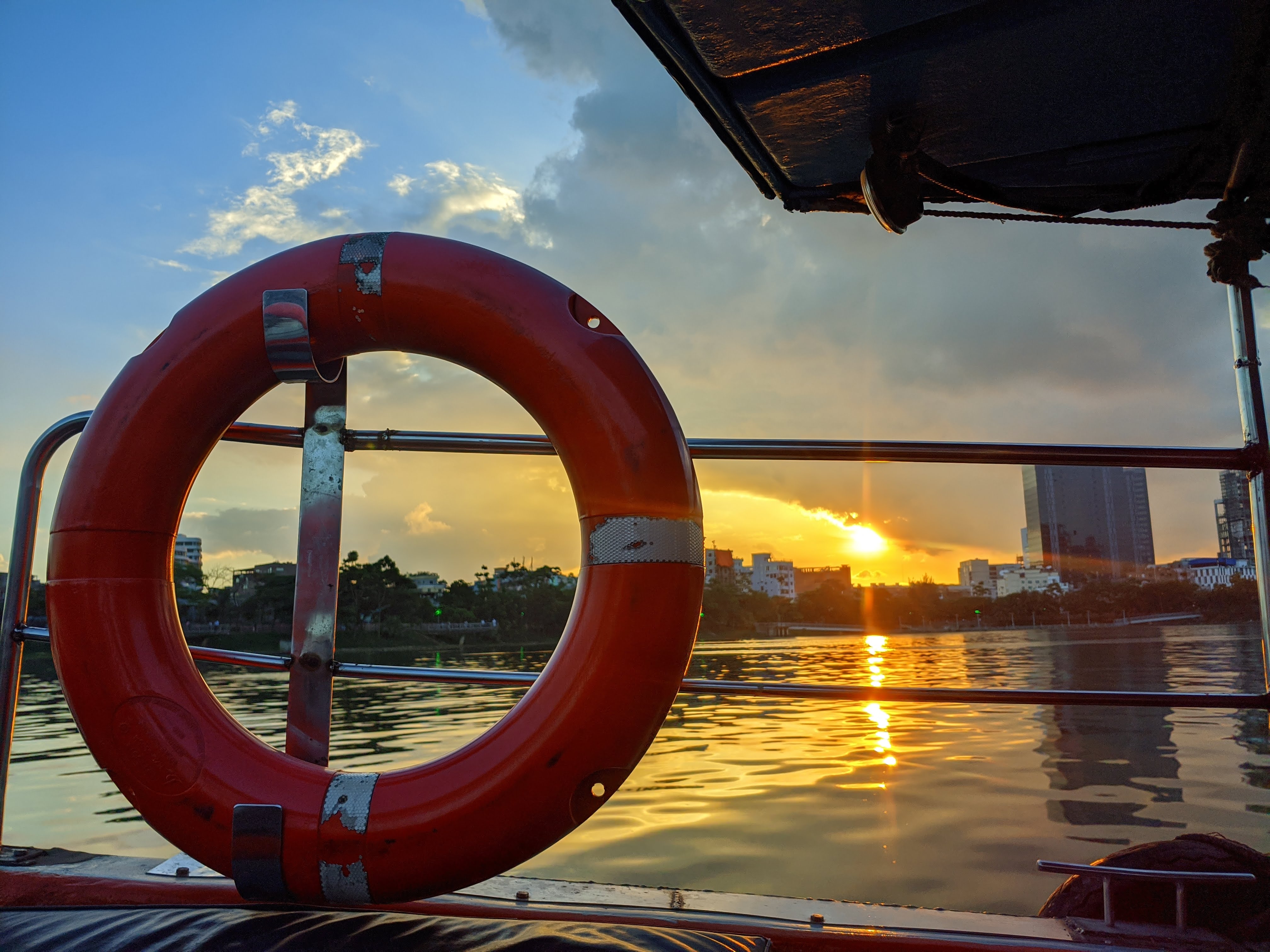 Sunset over the water from a boat deck